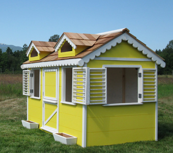 Little Cedar Cottage painted yellow. Beautiful playhouse